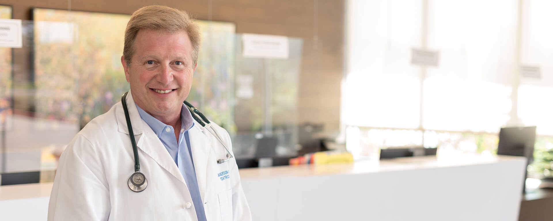 ARC Physician at a front lobby of a clinic with a blurry background