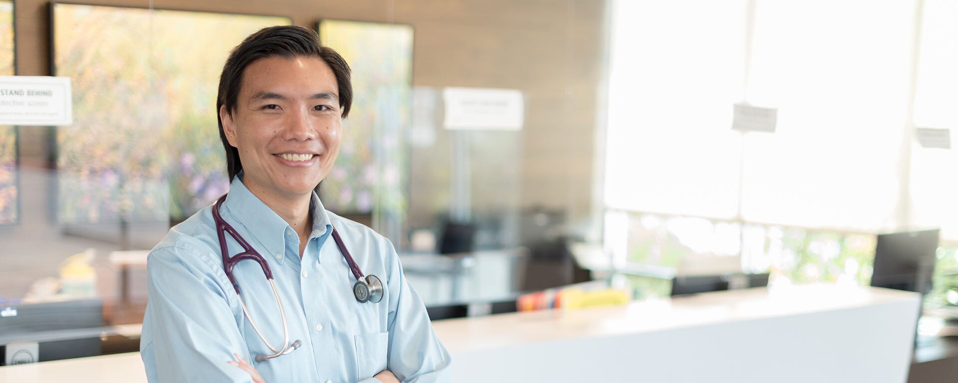 ARC doctor at a lobby of an ARC clinic with a blurry background