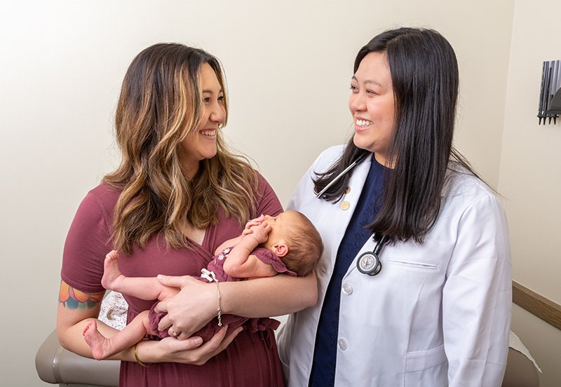 Pediatrician meeting a parent and their baby during a Pediatric Meet & Greet