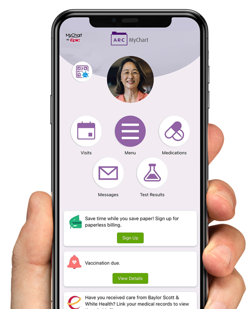 Hand holding phone with mychart app displayed